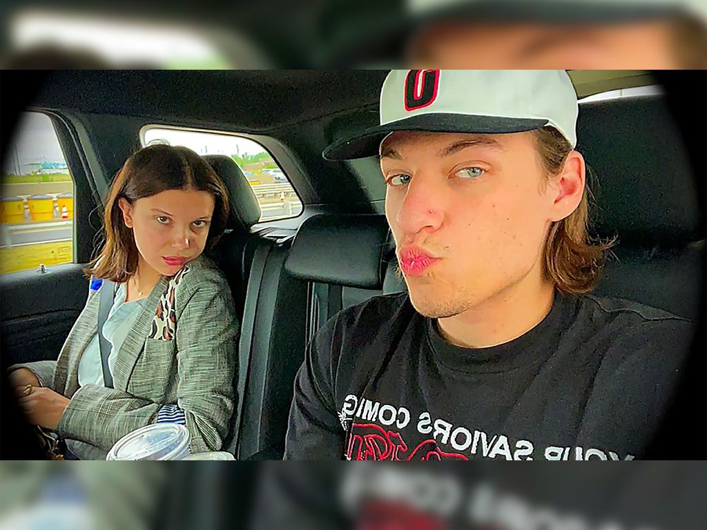 Millie Bobby Brown and Jake Bongiovi sitting together in a car.