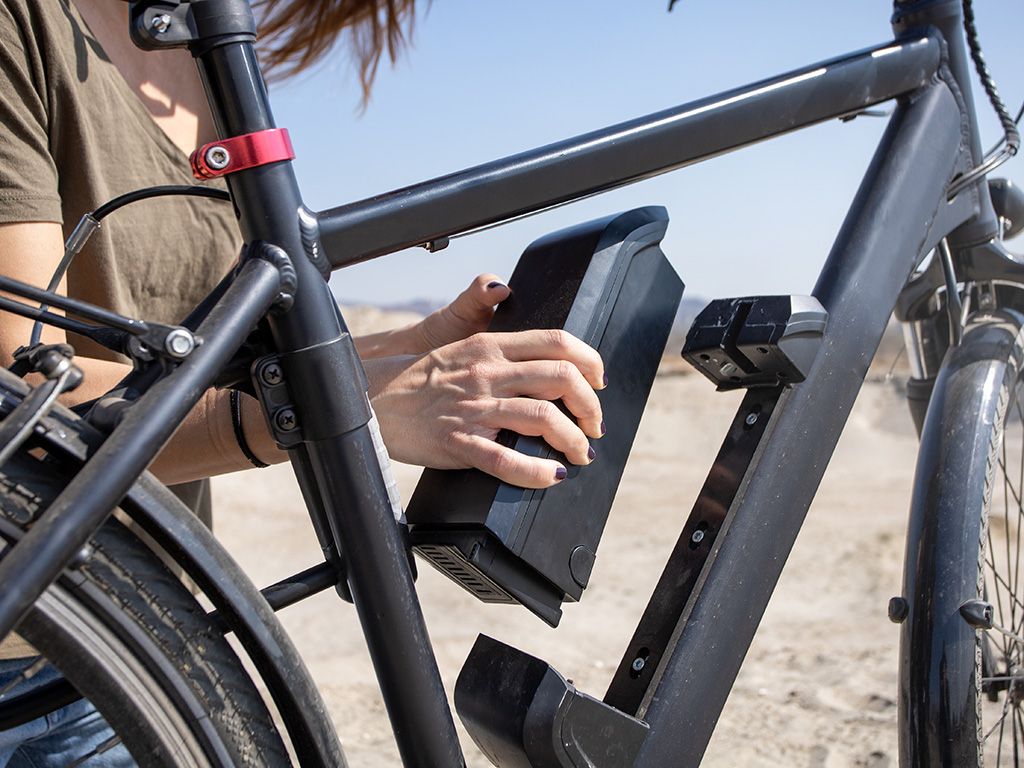 inserting e-bike battery on frame