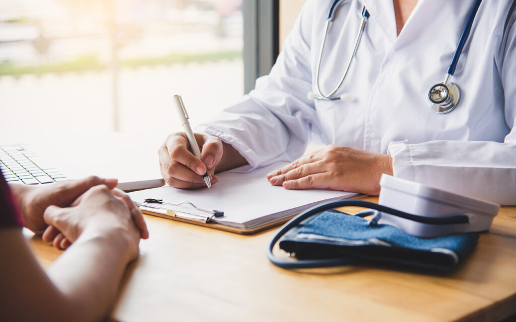 Doctor filling out paperwork