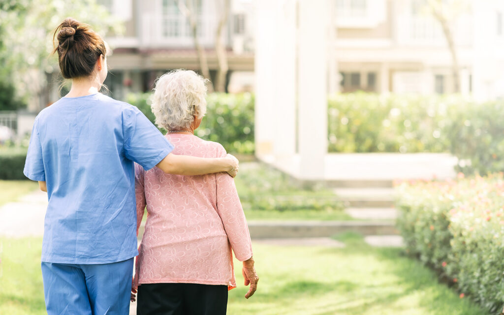 Elderly woman and her nurse