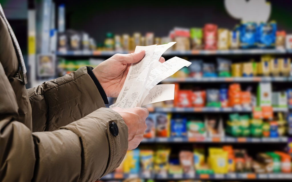 Person holding receipts 