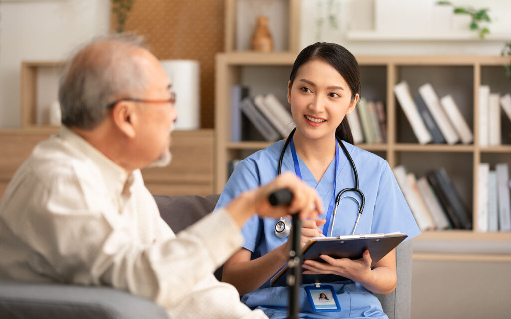 Nurse talking to an elderly patient