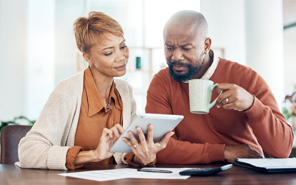 Older couple looking at an iPad