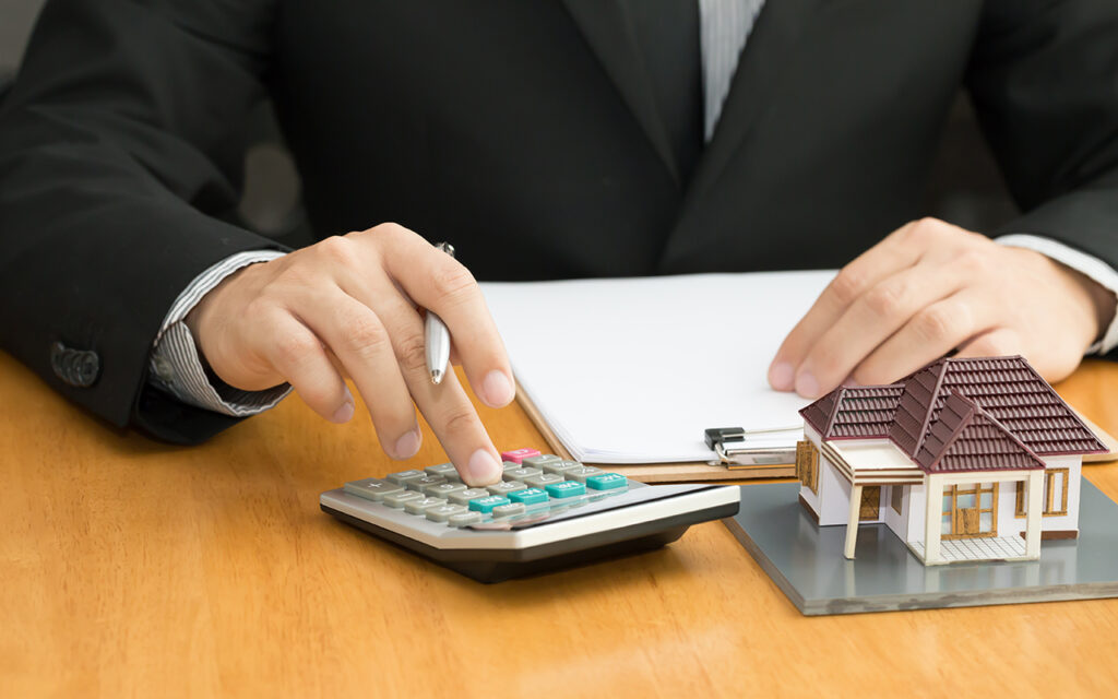 Person with calculator and paperwork