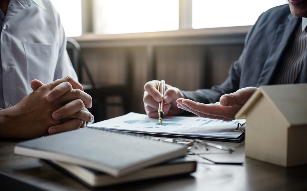 Two people looking at financial paperwork
