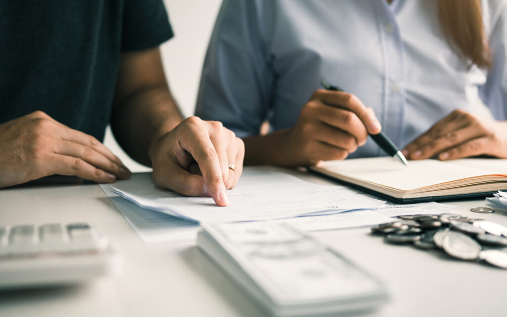 Two people looking over paperwork