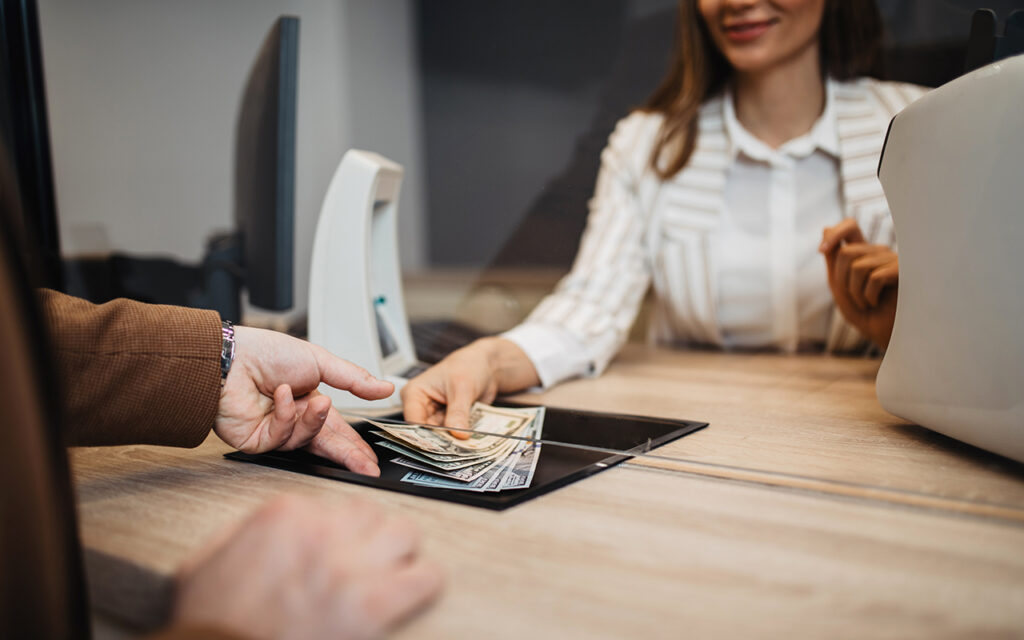 Person receiving money at the bank