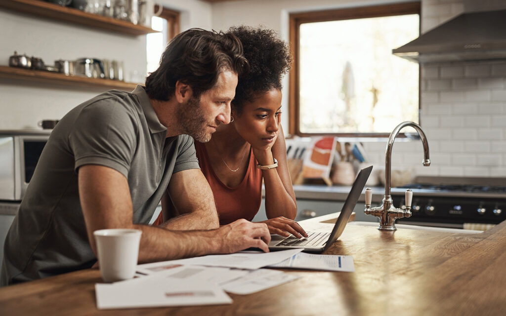 Couple looking at laptop