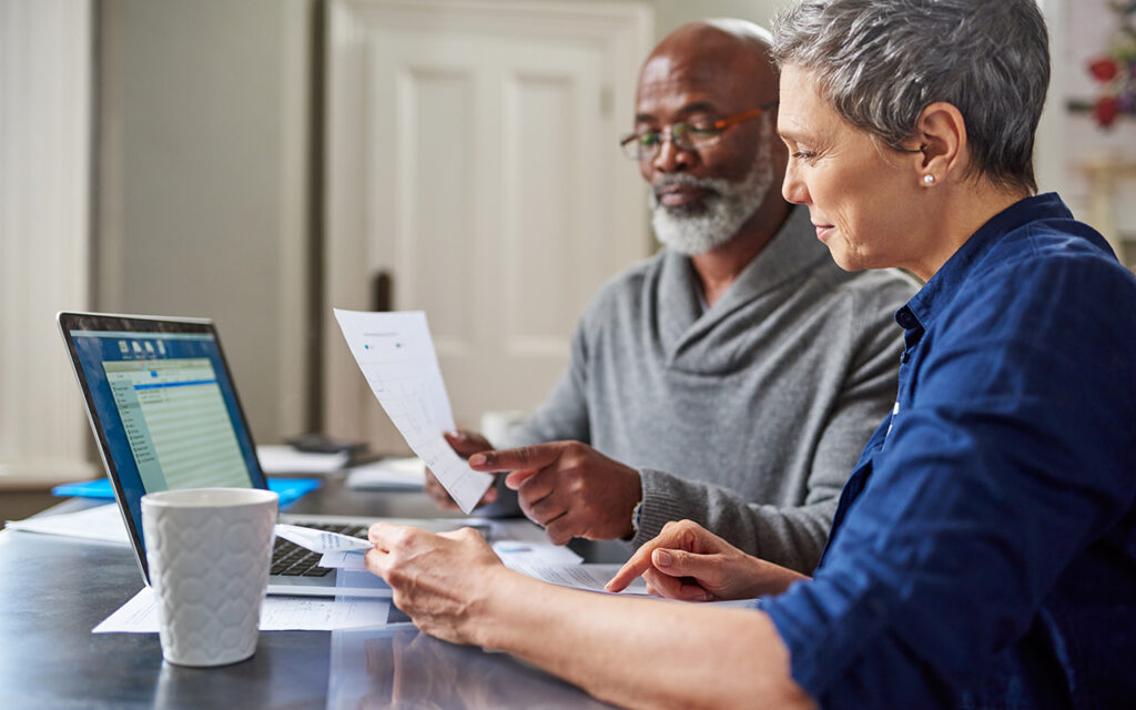 Two people looking over paperwork