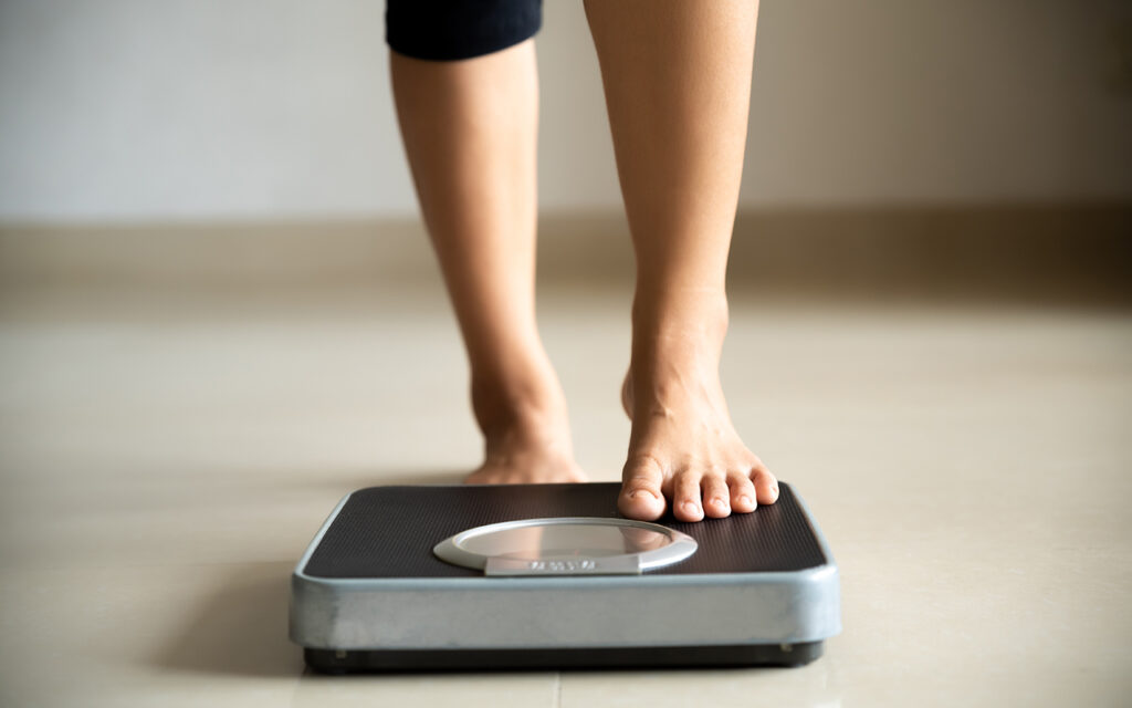 Person stepping on a scale