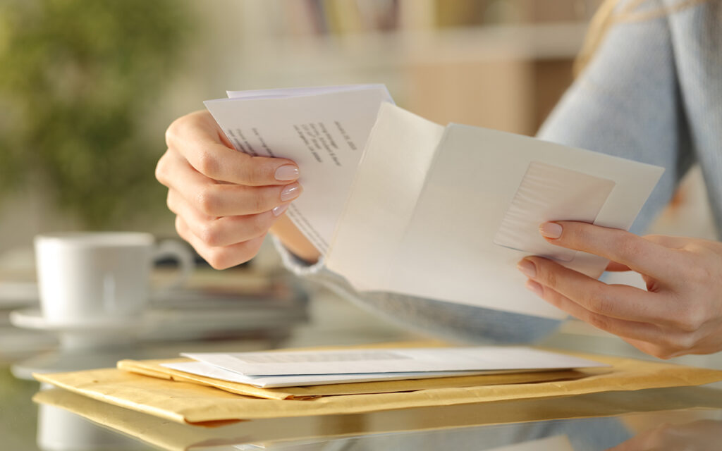 Woman opening mail
