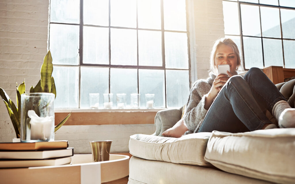 Woman sitting next to window