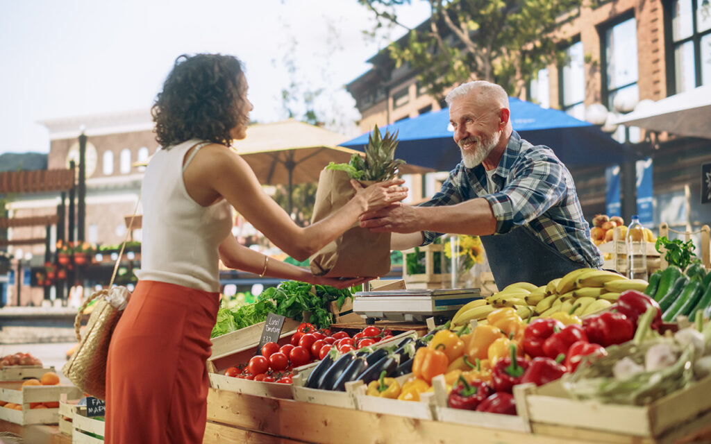 Farmers market vendor and customer